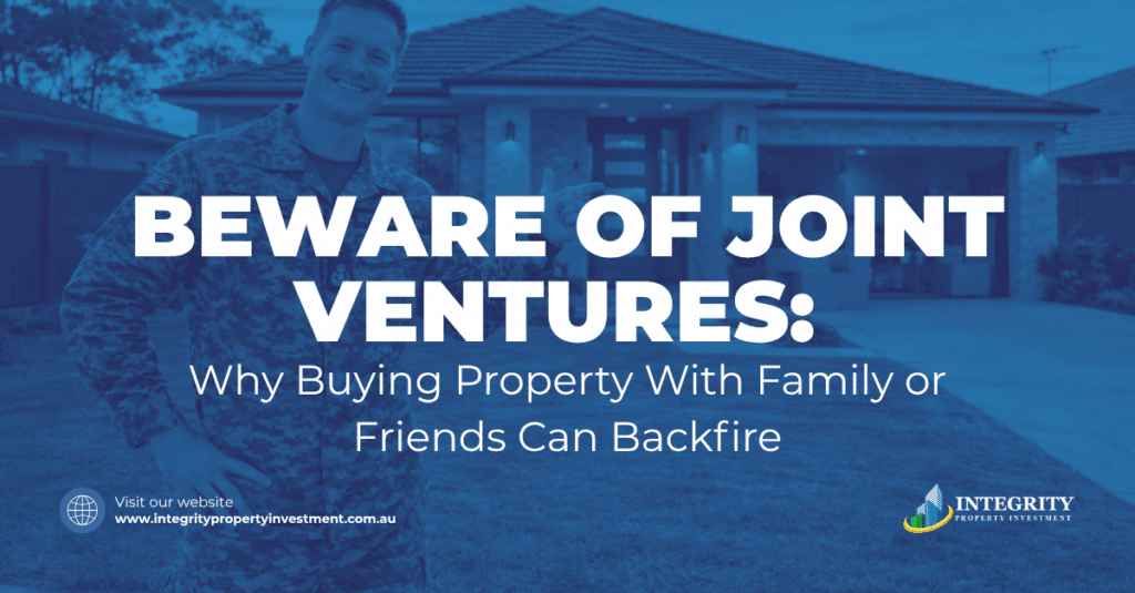 Two people reviewing a joint venture property agreement and its impact on borrowing capacity